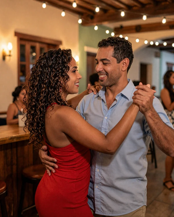American man and Dominican woman dancing bachata together in a Santo Domingo bar - cross-cultural dating in the Dominican Republic