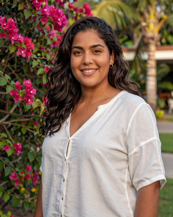 Beautiful Dominican woman smiling warmly in a tropical garden - authentic Dominican dating culture and Caribbean charm