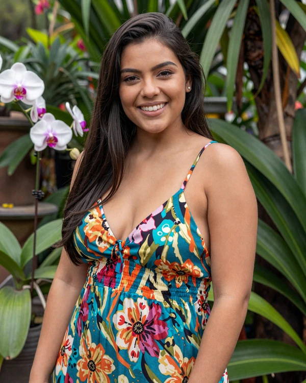 Colombian woman smiling in a tropical garden in Medellín - authentic Colombian dating culture and natural beauty