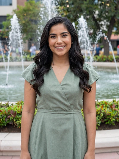 Ana, 32, Mexican single from Monterrey in a modern park with fountains and greenery