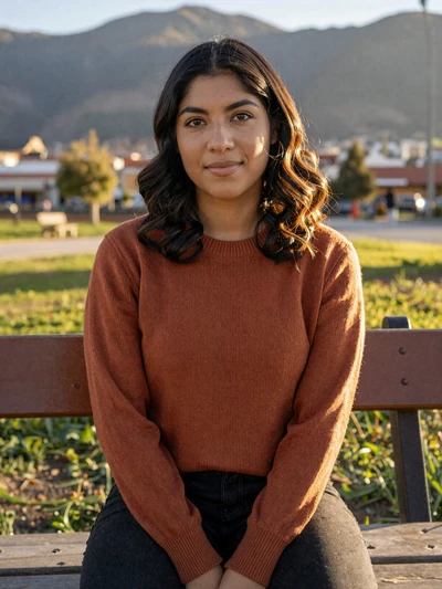 Rosa, 29, verified Peruvian single from Lima seated in a sunlit park with warm expression